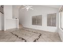 Open concept living room with vaulted ceilings, tile floors, and large windows with lots of light at 1535 N Horne -- # 35, Mesa, AZ 85203
