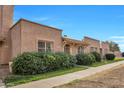 Inviting townhome with a well-maintained front garden at 3220 W Laurie Ln, Phoenix, AZ 85051