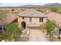 Aerial view of a two-story home with desert landscaping and mountain views at 42410 N 46Th Ln, Phoenix, AZ 85086