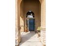 Inviting front entryway with arched details, stone accents, and a welcoming atmosphere at 42410 N 46Th Ln, Phoenix, AZ 85086