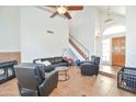 Open-concept living room featuring vaulted ceilings, a fireplace, and a staircase at 4670 W Linda Ln, Chandler, AZ 85226
