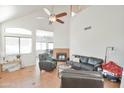 Bright living room with high ceilings, fireplace, ceiling fan, and comfortable seating at 4670 W Linda Ln, Chandler, AZ 85226