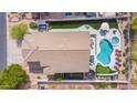 Aerial view of the backyard oasis, showcasing a pool, hot tub, putting green and lounge area at 7242 E Tyndall St, Mesa, AZ 85207