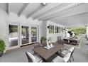 Inviting covered patio with outdoor kitchen, dining, and seating areas at 7250 E Paradise Dr, Scottsdale, AZ 85260