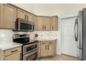 This kitchen boasts modern stainless steel appliances, sleek cabinets, and elegant countertops at 7445 E Eagle Crest Dr # 1122, Mesa, AZ 85207