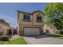 Beautiful two-story home with a two-car garage, and desert landscaping at 927 W Azalea Pl, Chandler, AZ 85248