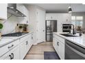 Charming modern kitchen boasting a gas cooktop, stainless appliances, and ample counter space at 32538 N 133Rd Ave, Peoria, AZ 85383