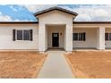 A beautifully staged front entrance to a single Gathering new construction house at 6515 N Loma Ct, Casa Grande, AZ 85194