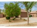 Inviting single-story house with a two-car garage and tidy desert landscaping at 11277 W Buchanan St, Avondale, AZ 85323