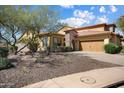 Charming single-Gathering home with stone accents, desert landscaping, and a paved driveway at 12047 W Red Hawk Dr, Peoria, AZ 85383