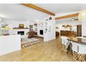 Bright living room features a fireplace, built-in shelving, and seamless flow to kitchen/dining area at 1508 W Kiowa Ave, Mesa, AZ 85202