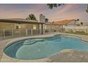 Stunning private backyard pool featuring secure fencing, perfect for outdoor relaxation and entertainment at 1508 W Kiowa Ave, Mesa, AZ 85202