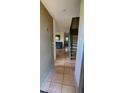 View of the tiled entryway leading to the living area and staircase in this home at 1706 W Village Way, Tempe, AZ 85282