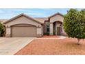 Inviting exterior of a single-story home with neutral stucco and a well-maintained front yard at 2319 E San Tan Dr, Gilbert, AZ 85296