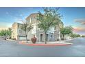 Exterior of a condo featuring a garage, windows, and neutral-toned paint at 2402 E 5Th St # 1532, Tempe, AZ 85288