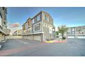 Exterior of a condo featuring a garage, windows, and neutral-toned paint at 2402 E 5Th St # 1532, Tempe, AZ 85288