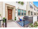 Charming townhome exterior featuring a cozy front porch with seating and decorative details at 2658 S Sulley Dr # 102, Gilbert, AZ 85295