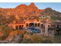 Luxury home nestled in the mountains with a private pool and multiple outdoor living areas at 26796 N 98Th Way, Scottsdale, AZ 85262