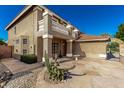 Exterior of the home with desert landscaping and a private entrance at 7164 W Paso Trl, Peoria, AZ 85383