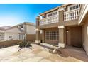 Charming home with a private courtyard, desert landscaping, and a balcony at 7164 W Paso Trl, Peoria, AZ 85383