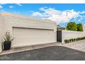 Charming single-Gathering home features a brick driveway, two-car garage, and mature landscaping at 7770 E Camelback Rd # 11, Scottsdale, AZ 85251