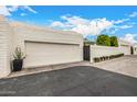 Charming single-Gathering home features a brick driveway, two-car garage, and mature landscaping at 7770 E Camelback Rd # 11, Scottsdale, AZ 85251