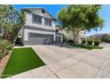 Charming home with a well-manicured lawn and mature trees adding to its curb appeal and a two car garage at 9618 E Monterey Ave, Mesa, AZ 85209