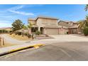 Charming two-story home with a three-car garage, driveway and well-maintained landscaping at 9665 E Nido Ave, Mesa, AZ 85209