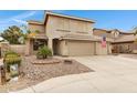 Charming two-story home with a three-car garage and well-maintained landscaping at 9665 E Nido Ave, Mesa, AZ 85209
