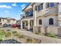 Lovely two-story townhome features a balcony and a well-maintained front yard at 9906 E Wavelength Ave, Mesa, AZ 85212
