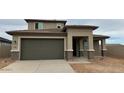 Well-maintained single-Gathering home featuring a spacious two-car garage and a desert landscape at 15146 W Gray Fox Trl, Surprise, AZ 85387