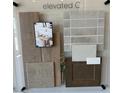Home interior design selections showcase a warm color palette and a variety of textures and materials at 15146 W Gray Fox Trailer, Surprise, AZ 85387