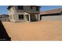 Large dirt backyard with ample space for outdoor activities and entertaining at 15151 W Gray Fox Trl, Surprise, AZ 85387