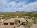 Expansive desert home with a private pool, three-car garage and mountain views at 4616 E Quien Sabe Way, Cave Creek, AZ 85331
