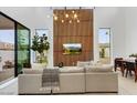 Living room featuring large sliding glass doors, clerestory windows, stylish decor and a comfortable seating area at 100 W Northern Ave # 6, Phoenix, AZ 85021