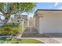 Exterior view of a home with white fencing and a red-tiled roof at 11465 N 56Th St, Scottsdale, AZ 85254