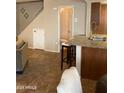 Spacious living area featuring tile floors, stairway and eat-in bar at 14636 N Yerba Buena Way # B, Fountain Hills, AZ 85268