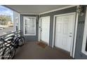 Front porch view with two doors and bicycles parked; a welcoming entrance to the unit at 1505 N Center St # 220, Mesa, AZ 85201
