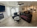 Spacious living room featuring modern decor, a stylish couch, and an open layout at 1505 N Center St # 220, Mesa, AZ 85201
