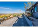 Exterior view of the home, showing the desert landscaping and mountain views at 1637 E Camino Del Santo --, Phoenix, AZ 85022