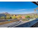Picturesque vista from a balcony showcasing mountain views and the neighborhood below at 1637 E Camino Del Santo --, Phoenix, AZ 85022