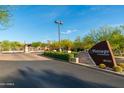 Welcoming entrance to the community of Vintage at Grayhawk with desert landscaping and a gate at 20121 N 76Th St # 2064, Scottsdale, AZ 85255
