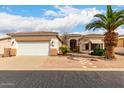 Inviting single-story home with a two-car garage and desert landscaping at 2101 S Meridian Rd # 26, Apache Junction, AZ 85120