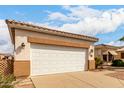 Spacious two-car garage with a white door and tan trim at 2101 S Meridian Rd # 26, Apache Junction, AZ 85120