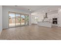 Open-concept living area with tile floors and sliding glass doors leading to the backyard at 21846 E Bonanza Ct, Queen Creek, AZ 85142