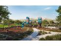 Community playground with swings, slides, and climbing structures provides a fun and active space for children at 2304 W Storia Ave, Apache Junction, AZ 85120