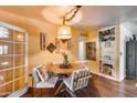 Inviting dining room with a round table, decorative accents and wood-look flooring at 304 W 6Th St, Mesa, AZ 85201