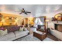 Cozy living room features a painted fireplace, stylish furnishings and lots of natural light at 304 W 6Th St, Mesa, AZ 85201