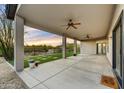 Covered patio featuring ample seating, ceiling fans, and a desert view at 32806 N 55Th Pl, Cave Creek, AZ 85331