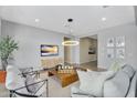 Inviting living room with stylish decor, contemporary lighting, and comfortable seating perfect for relaxation at 3347 E Malibu Dr, San Tan Valley, AZ 85143